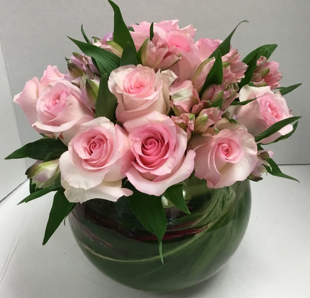 Leaf-lined bubble  bowl with pink roses and pink alstroemerias