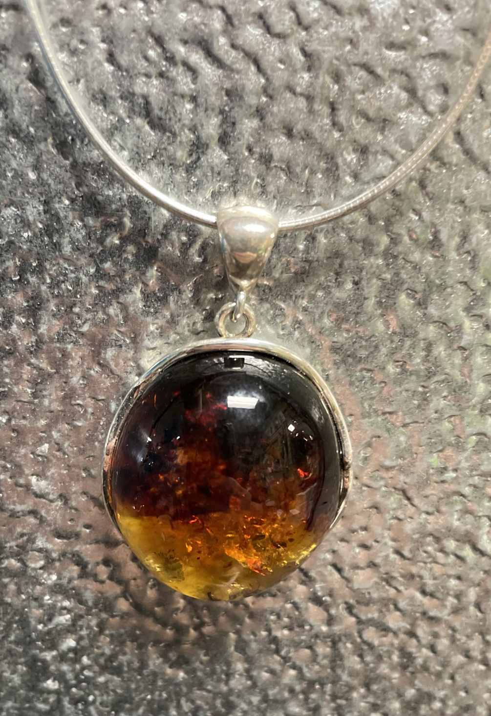This beautiful amber pendant comes complete with an Italian silver chain.
The amber