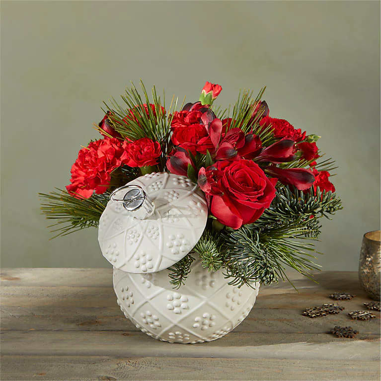 Bursting holiday spirit is elegantly symbolized in this deep red bouquet, where