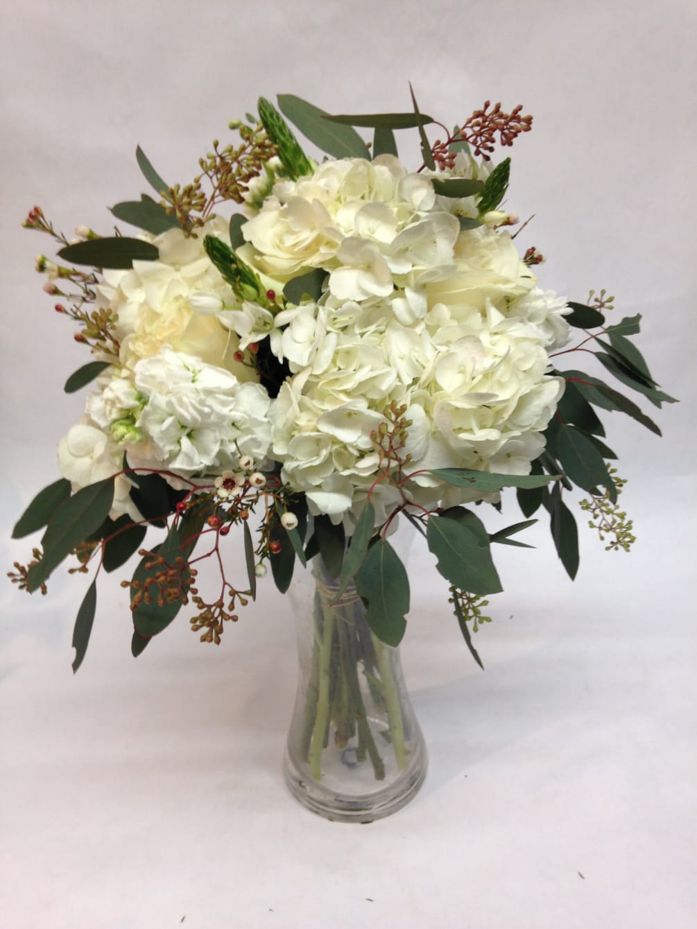 This textured hydrangea bouquet comes complete with stock, seeded eucalyptus and wax