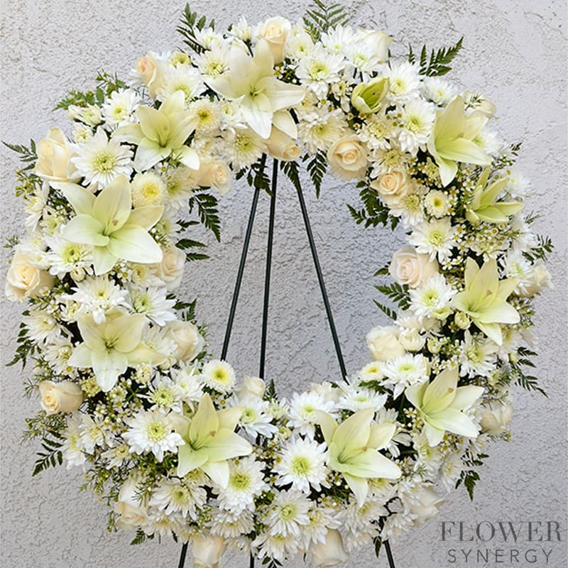 a Large Spray white and round memorial arrangement. This design fills a