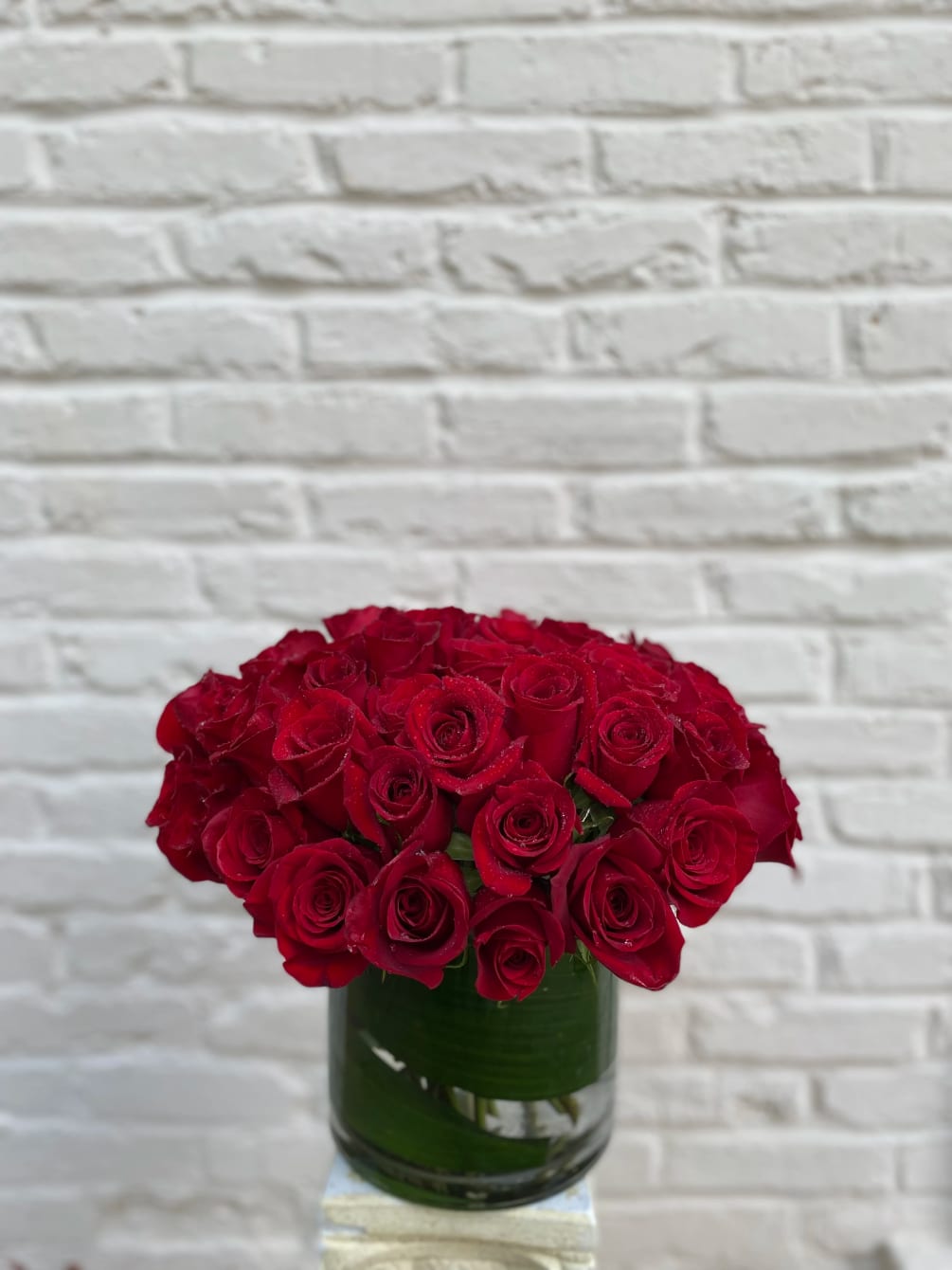 Express your love with this classic arrangement of four dozen red roses.