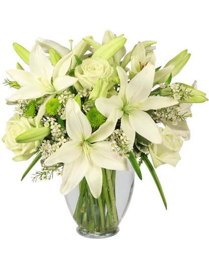 A peaceful all white arrangement of lilies and roses