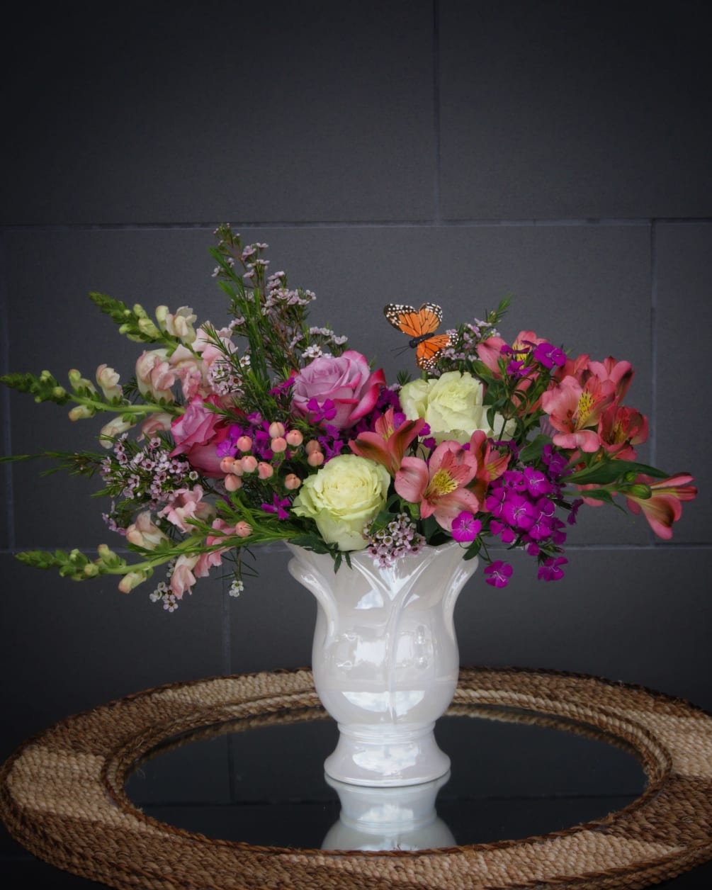 Lovely design including rose, snapdragon, sweet william, astroemeria and accents in a