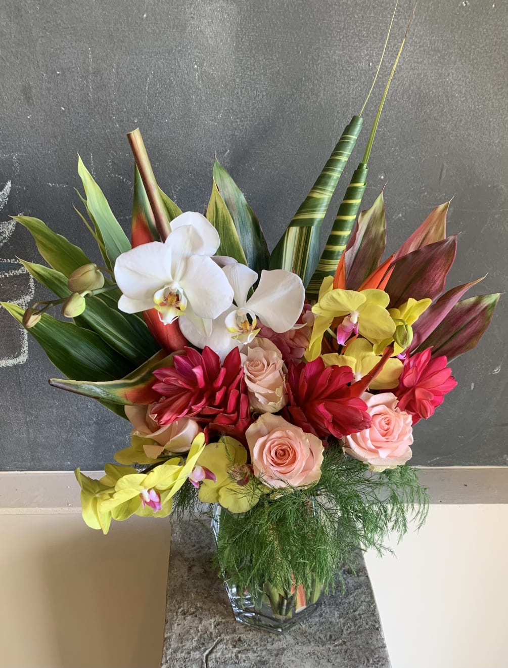 This arrangement brings the beauty of the tropics to life!