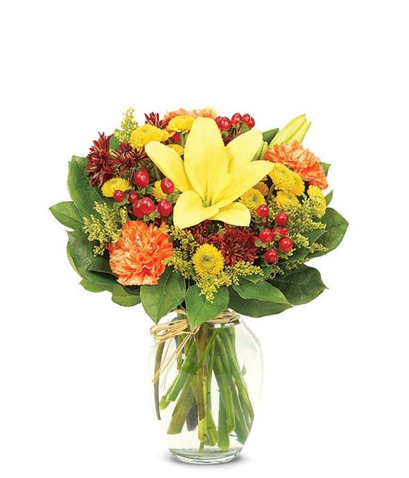 This graceful rose and lily bouquet full of Fall harvest colors will