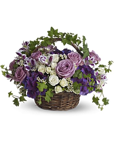 Lush flowers to celebrate a full life. This beautiful basket of flowers