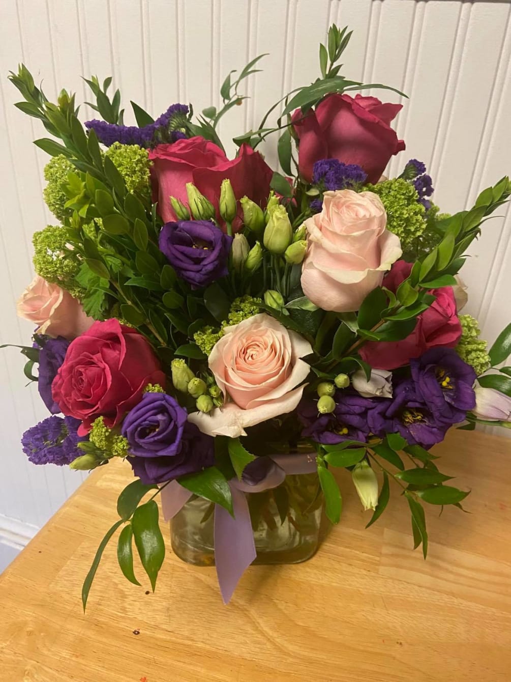 This arrangement includes Roses, Lisianthus, hydrangea