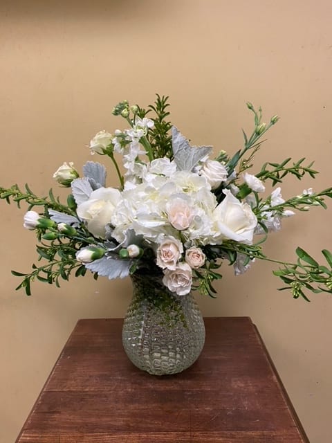 Seasonal mix of beautiful white and cream florals.