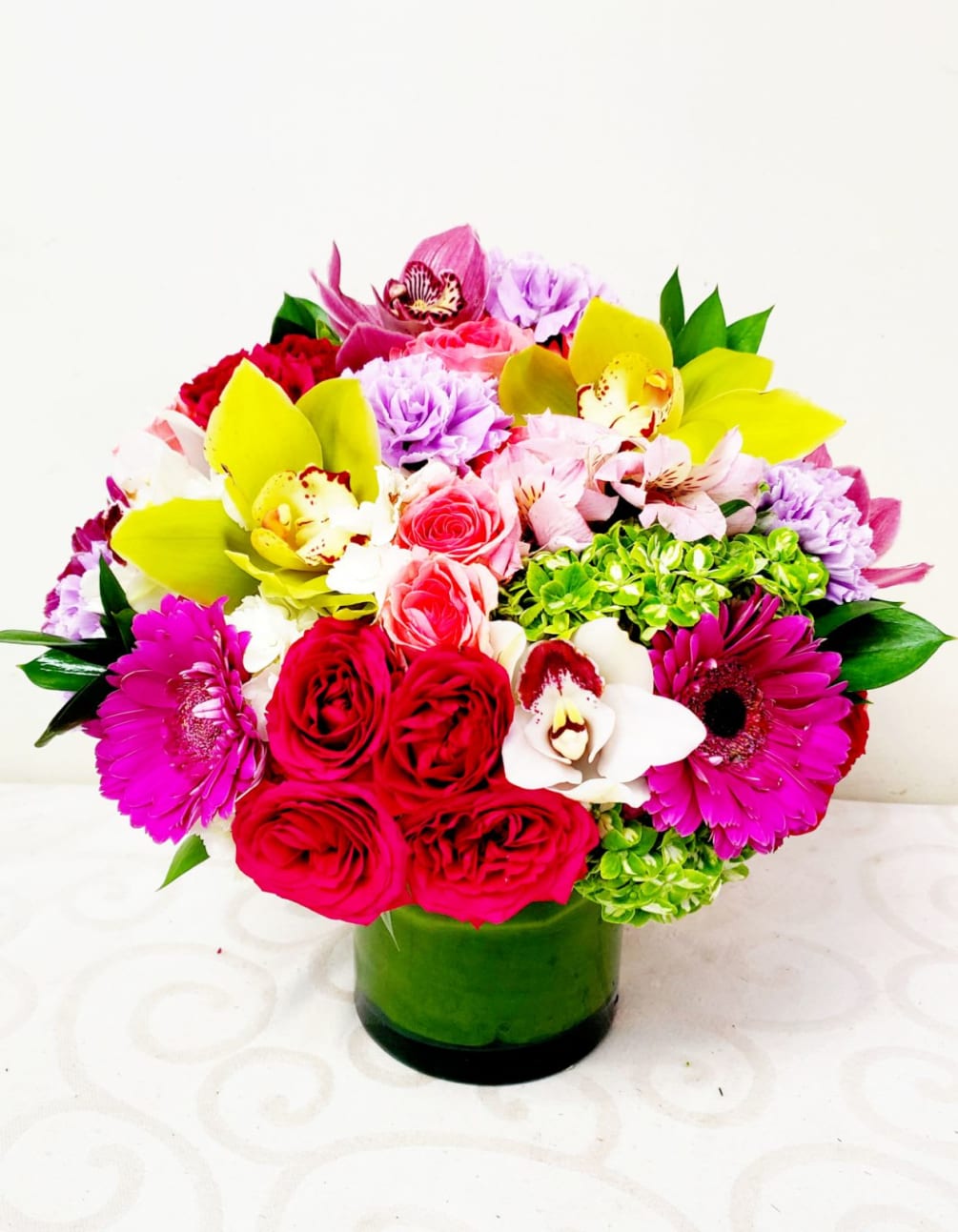 Wow her with this elegant and vibrant floral gift. The collaboration of