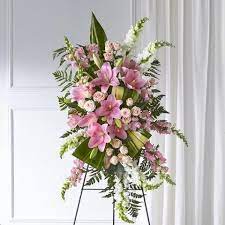 This elegant spray consists of pink lilies, white snapdragons, pink alstroemeria and