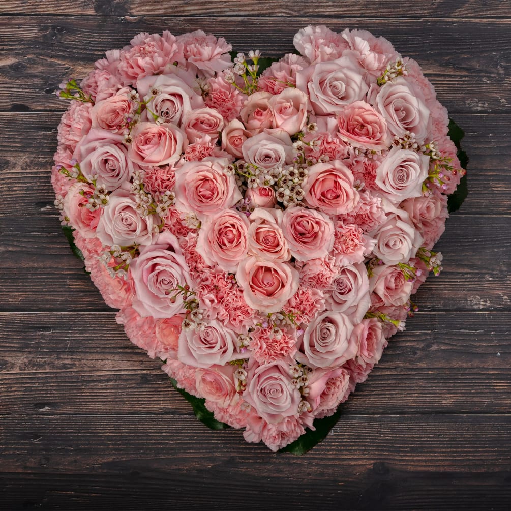  Our beautiful heart-shaped flower  creation is made of carnation pink