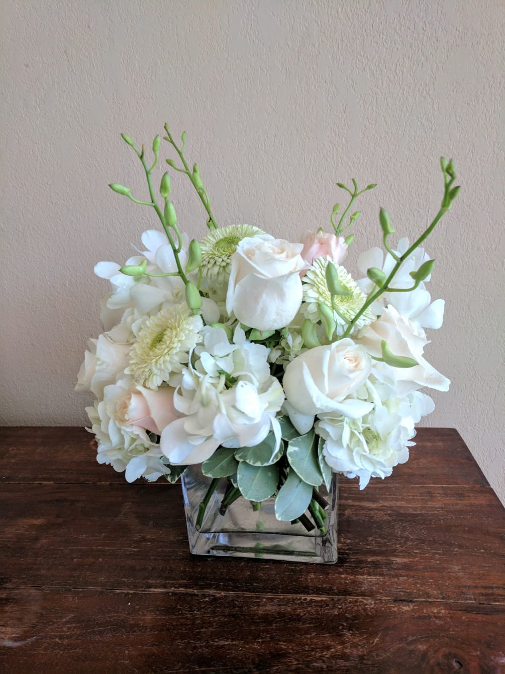 HYDRANGEA , ROSES, DENDROBIUM ORCHIDS AND GERBER DAISES ARRANGED IN A SQUARE