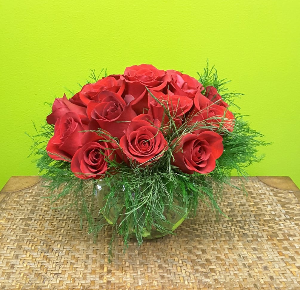 Our MODERN ROSE arrangement  is a dozen roses stylishly arranged,low and