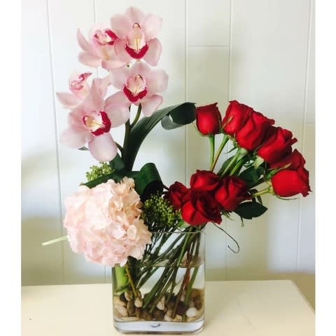 Order this beautiful and unique arrangement at Kenneth Village Flowers. We proudly