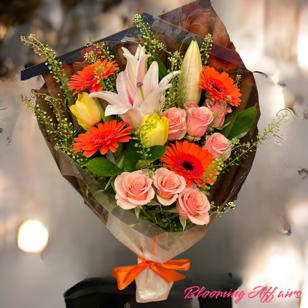 Gerbera Daisies, Tulips, Lilies  and Spray roses Bouquet without a vase