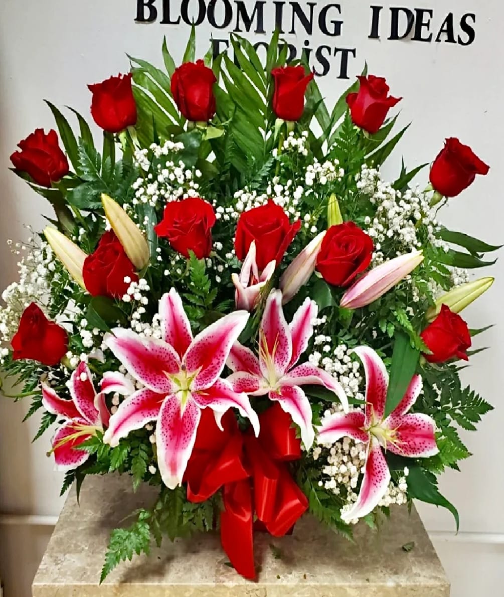 This beautiful arrangement comes with 12 roses with stargazer lilies.