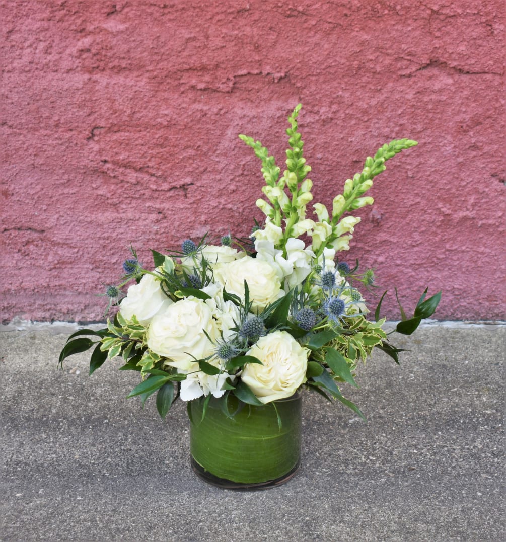 Clean, white, and modern, this elegant design is created using white snapdragons