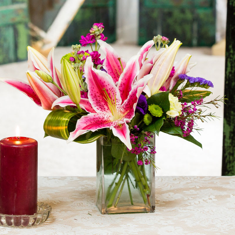 A bright bouquet bursting with color! Hot pink Stargazer lilies add beauty