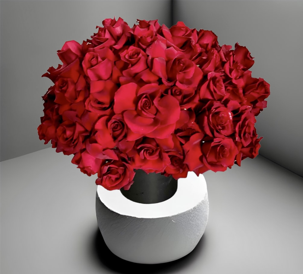 5 dozen hand opened Ecuadorian red roses in a black ceramic vase.