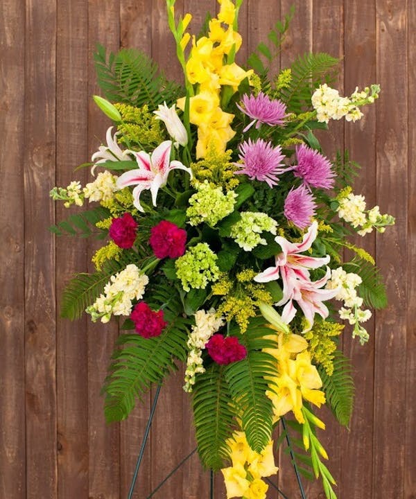 A wonderfully bright mix of gladioli, hydrangea, lilies, mums and more. 