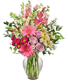 7&quot; classic urn vase
foliage: ivy, myrtle
2 pink gerberas
3 lavender roses
1 stem hot