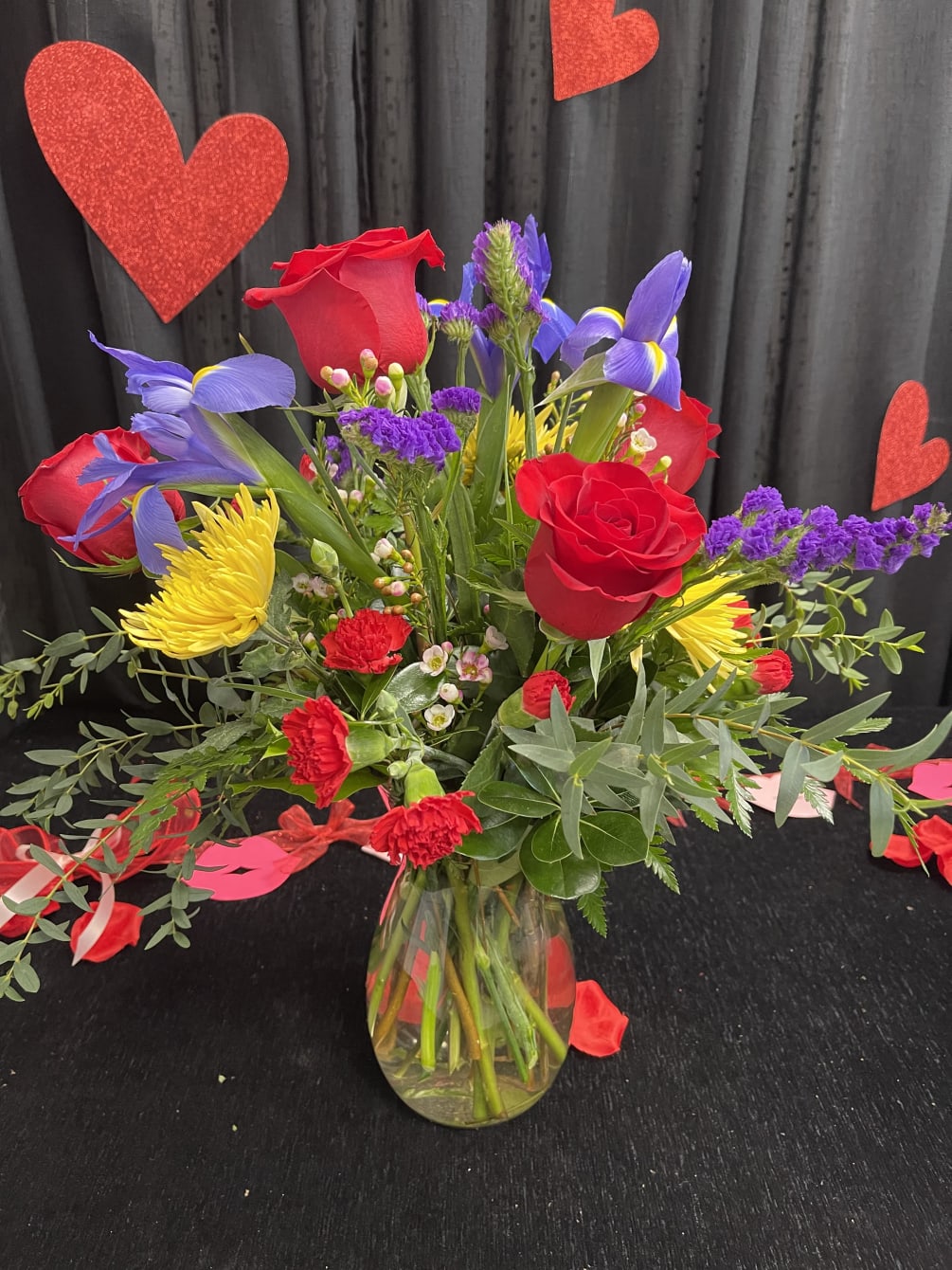 We just can&#039;t get enough of this arrangement with iris, red roses