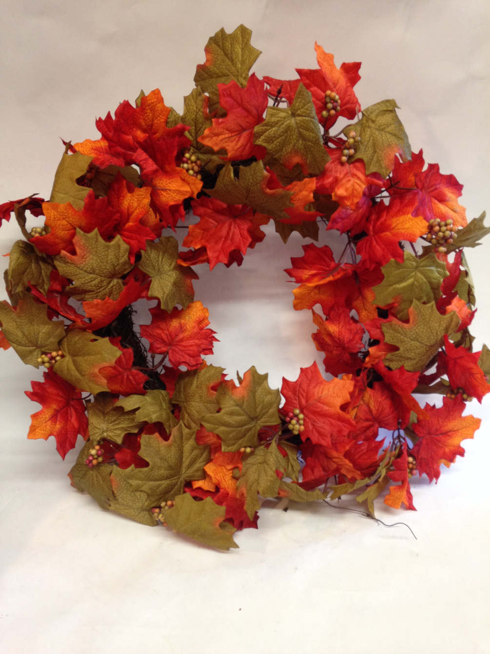 This bright autumnal wreath is perfect for any door or space to