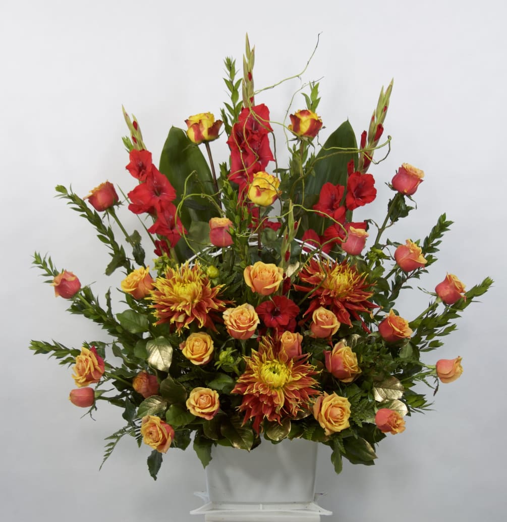 Flowers Included:

Red Gladiolus
Orange Roses
Yellow Roses
Curly Willow
Seasonal Dahlias
Seasonal Greens
 

 

Substitutions may be