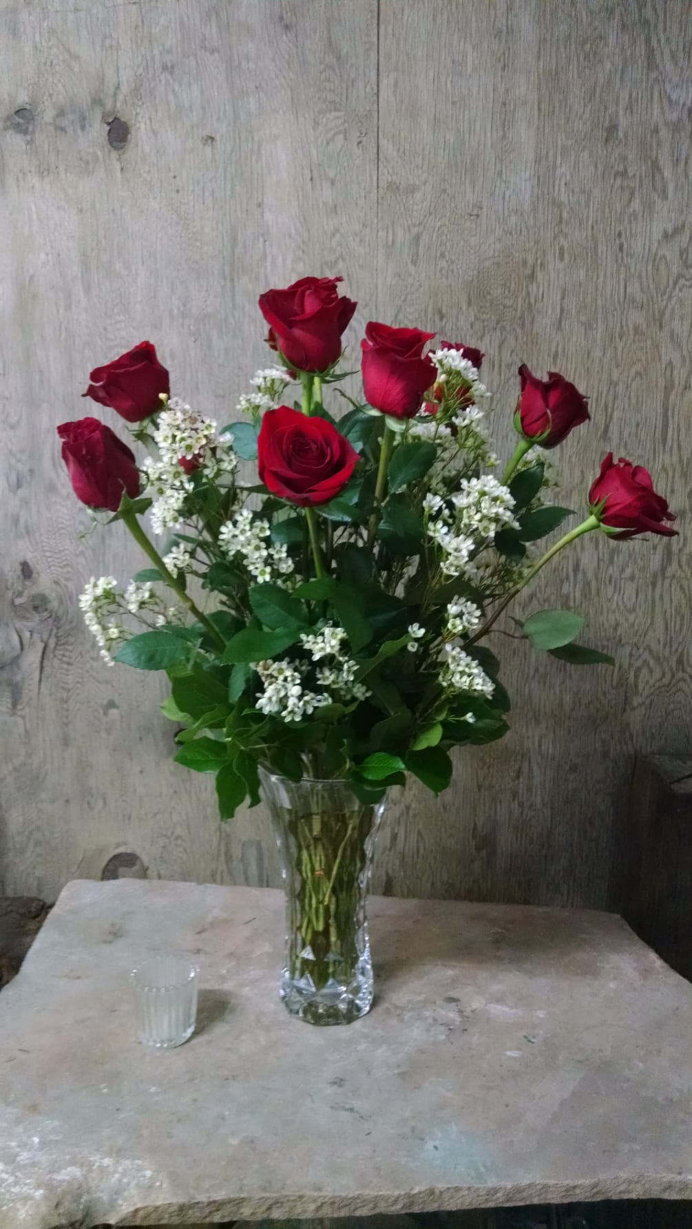 Red roses fashioned in a
 Heavy Crystal  like vase. Limited amount