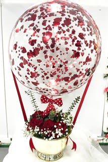 This 22 inch bubble with confetti hearts and flower base make a