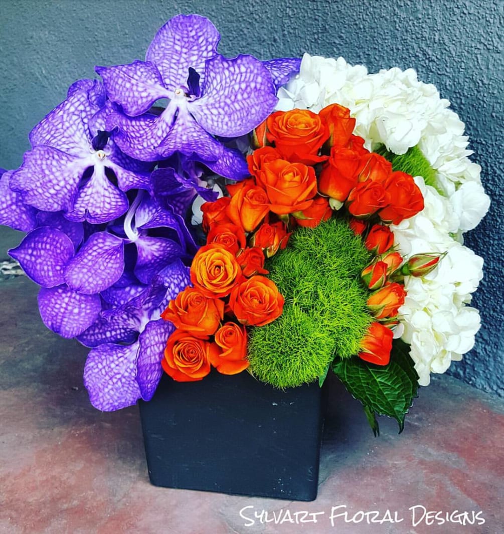 This beautiful Piece includes, Spray roses, Dianthus, Orchids, Hydrangeas. (Florals and container