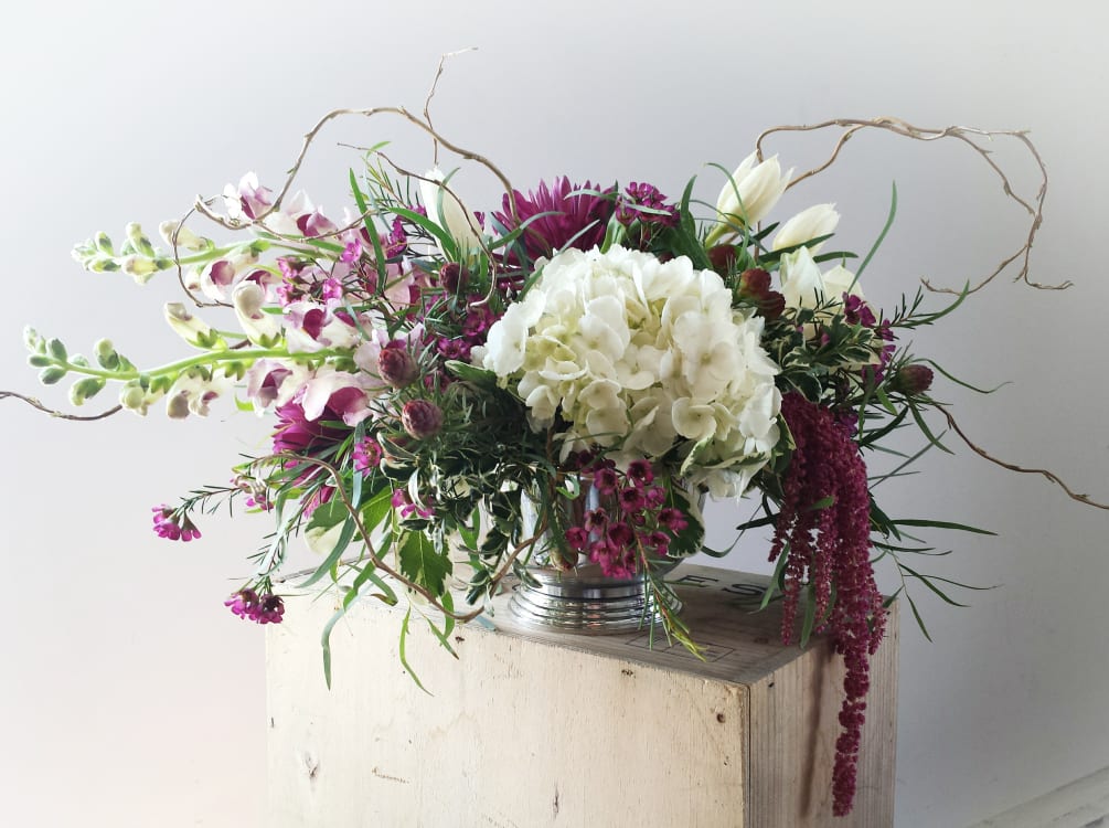 This lush, American garden-style arrangement features hydrangea and an assorted mix of