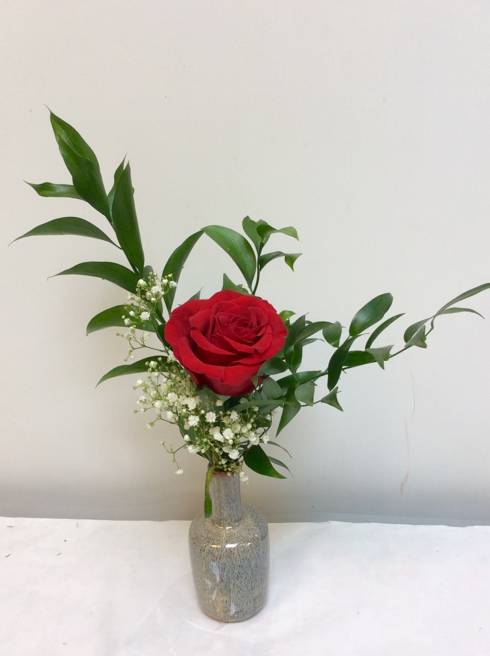 Quintessential &quot;i love you&quot; single red rose in a bud vase. 