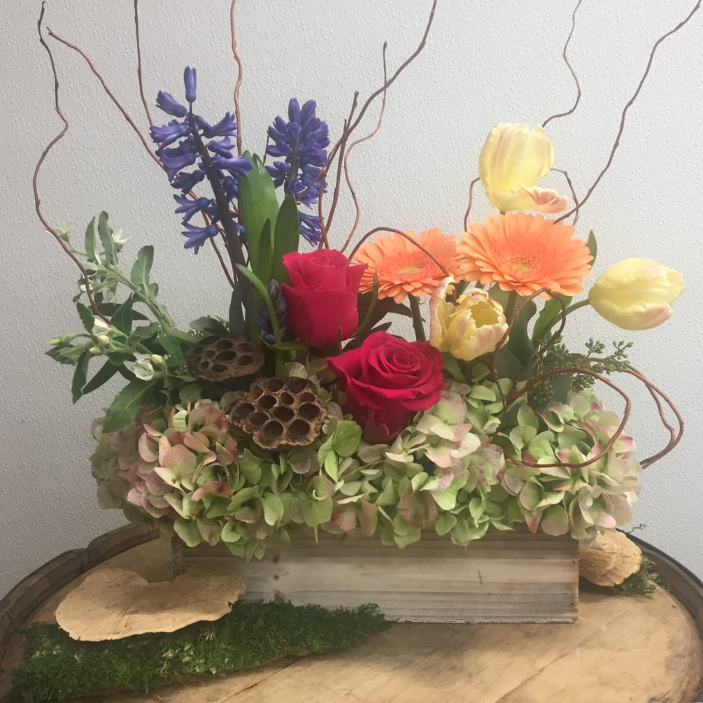 Let our designers select an assortment of fresh blooms to create a