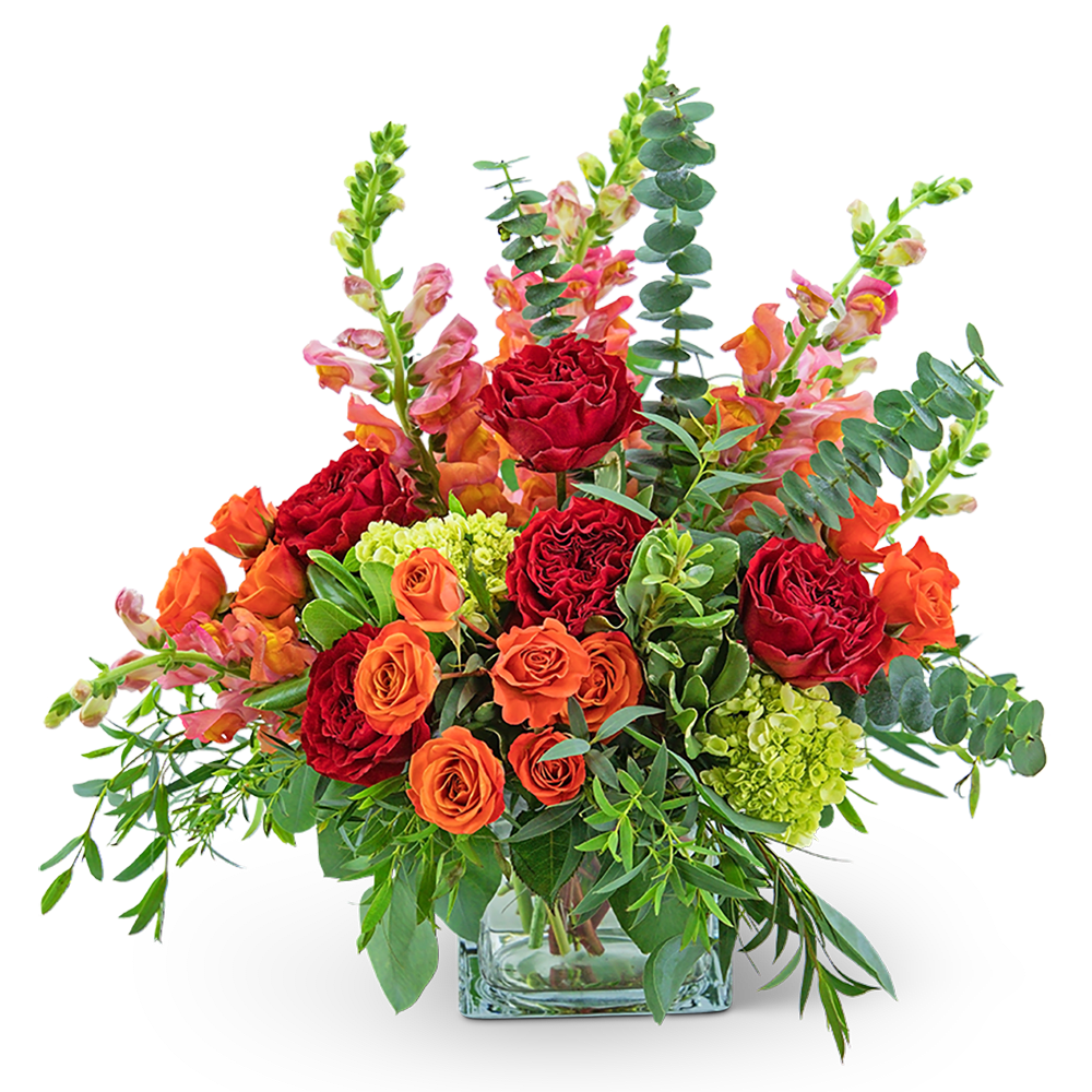 With its deep reds, oranges, and pinks, this arrangement is as stunning