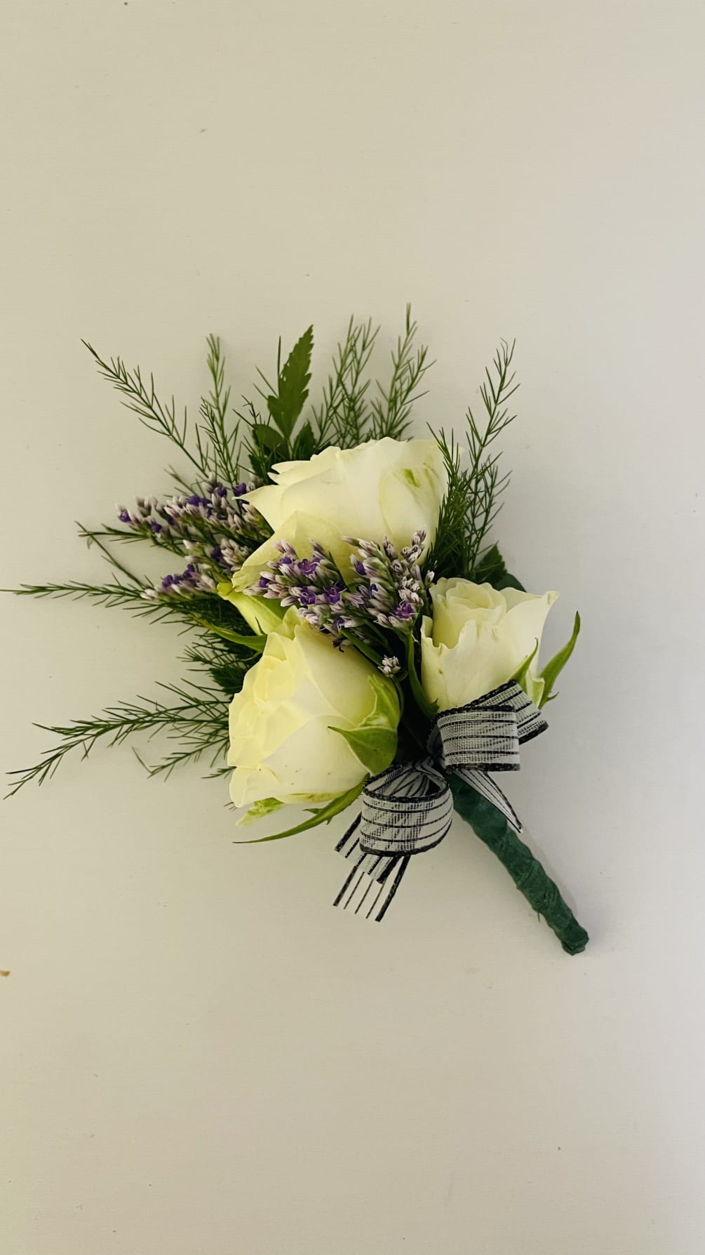 Beautiful boutonni&egrave;re with spray roses also you can ask for different color