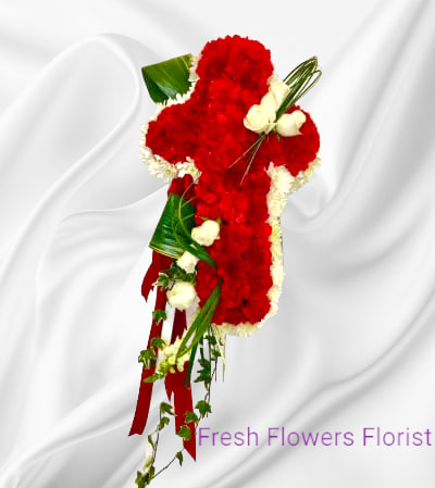 Red carnations with white roses for the standard size. For the deluxe