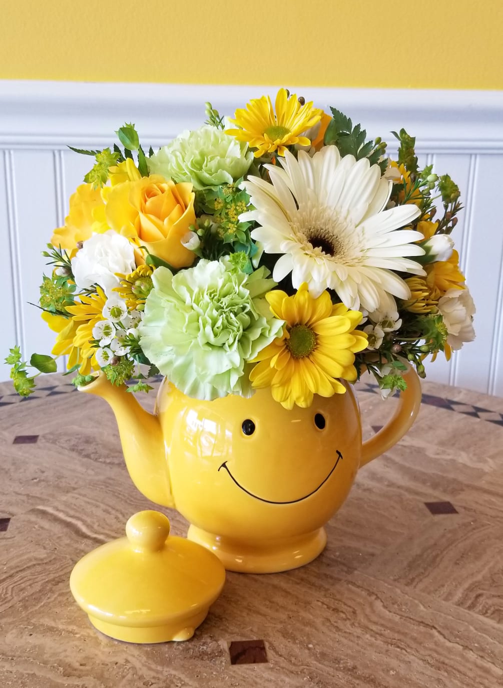Send this adorable yellow smiley tea kettle filled with bright and sunny