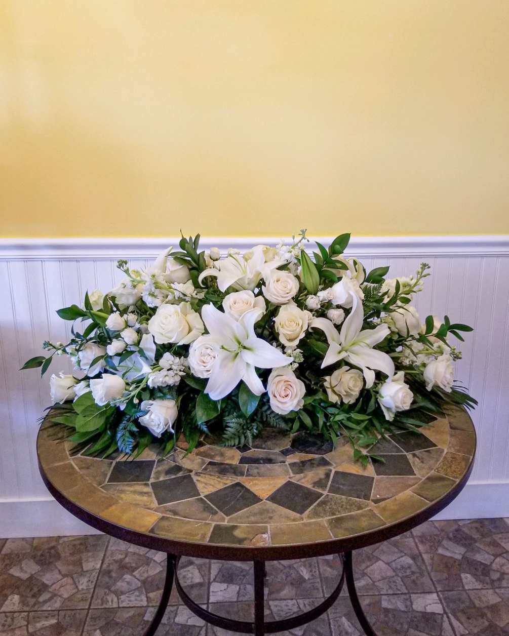 Created by our own Jacqueline&#039;s Flowers designers, this all white full casket