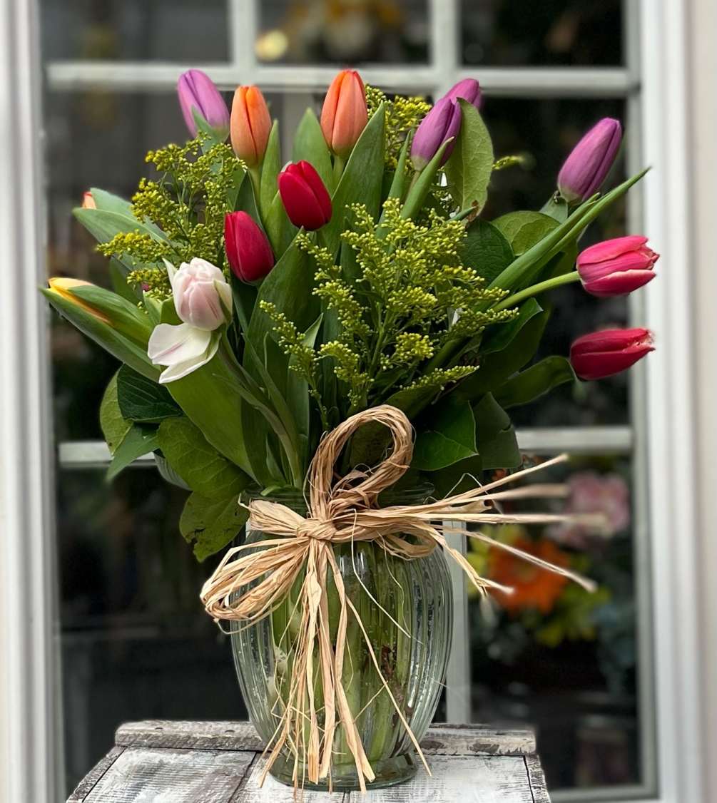 Our cut glass vase filled with colorful tulips that would brighten anyone&#039;s