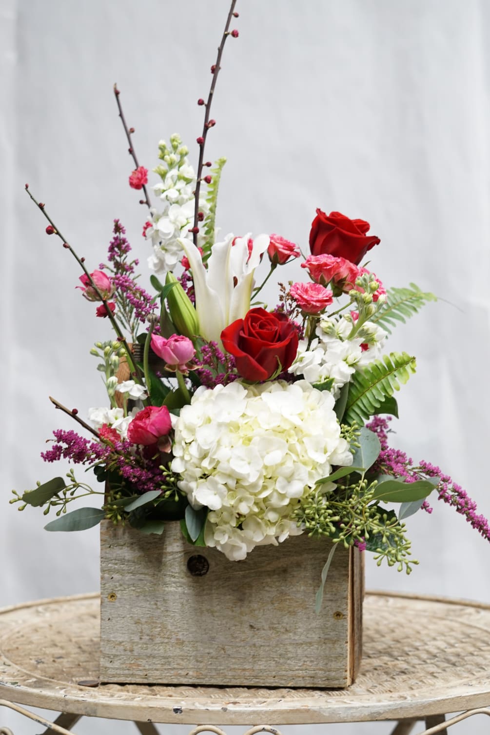 We build this beautiful fresh arrangement with all your favorites- White Hydrangea