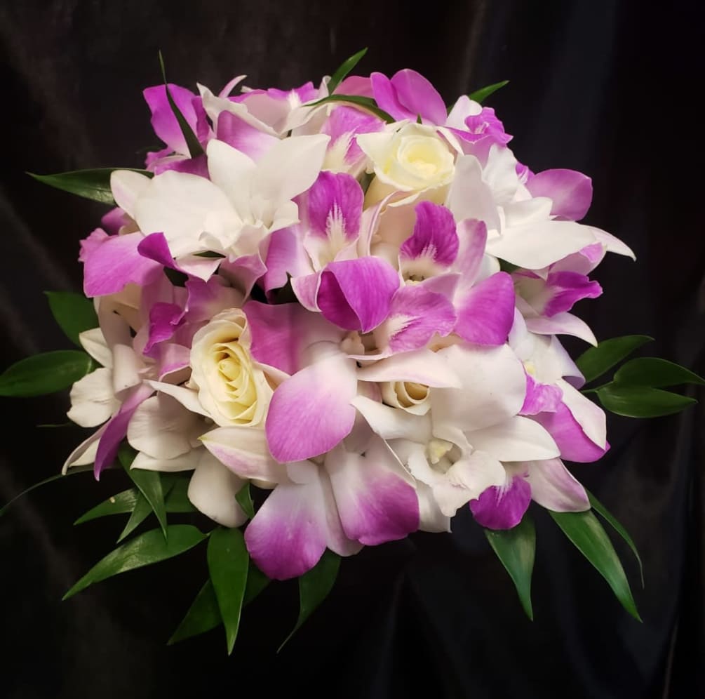 White + purple dendrobium orchids, roses, ruskus 