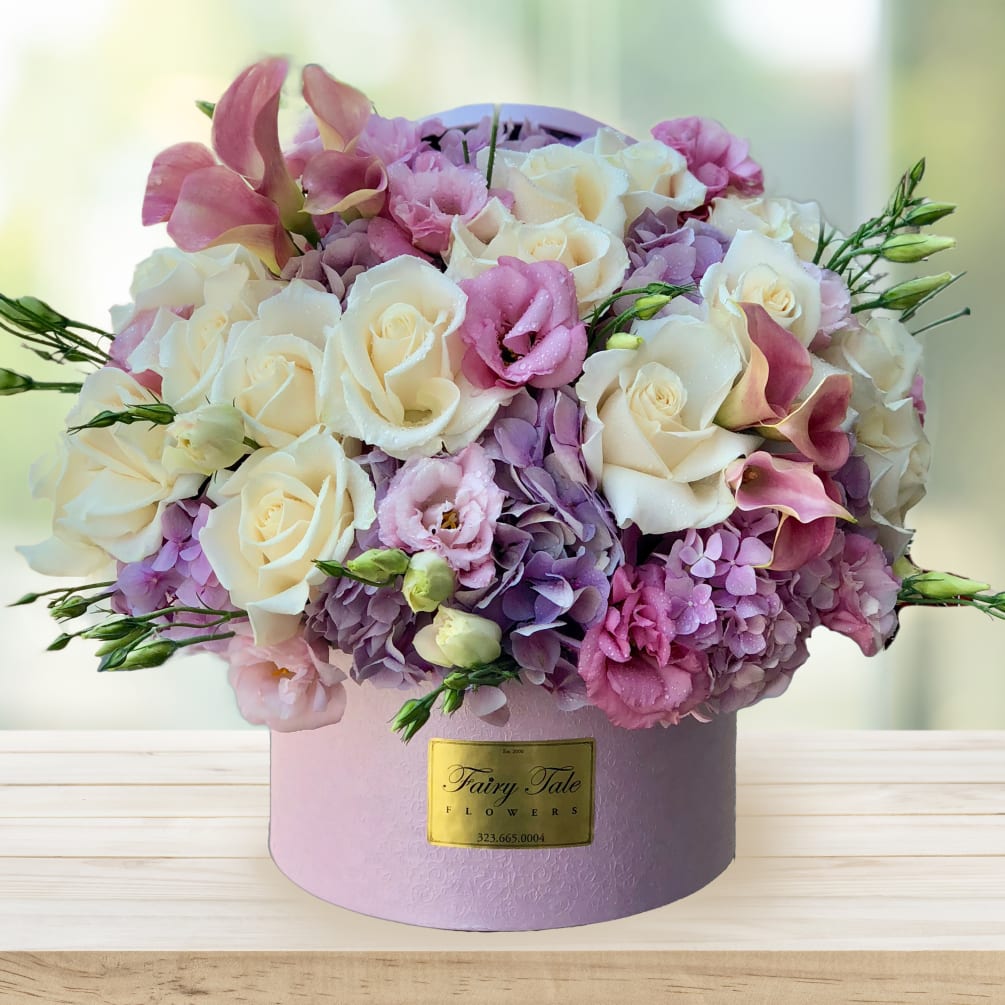 A beautiful arrangement with hydrangeas, calla lilies, roses, and lisianthus