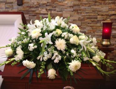Half casket spray:
Gorgeous white roses, white lilies, white chrysanthemums, and white gladiolus.

Delivery:
&acirc;&euro;&lsaquo;All