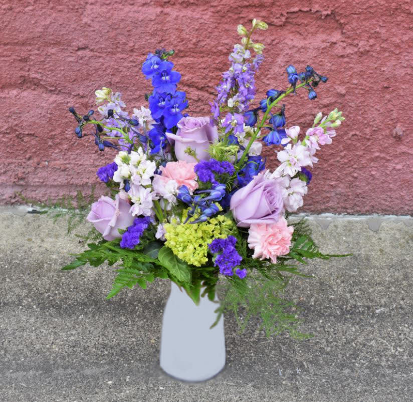 Purple Larkspur, blue delphiumium, pink stock, green hydrangea, lavender roses, pink carnations