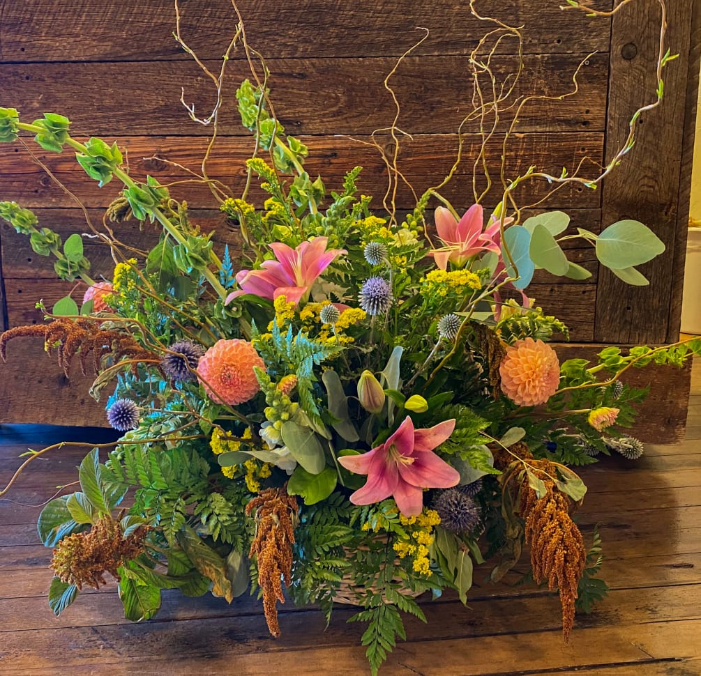 Overflowing with blooms, this arrangement is big, bright and beautiful!