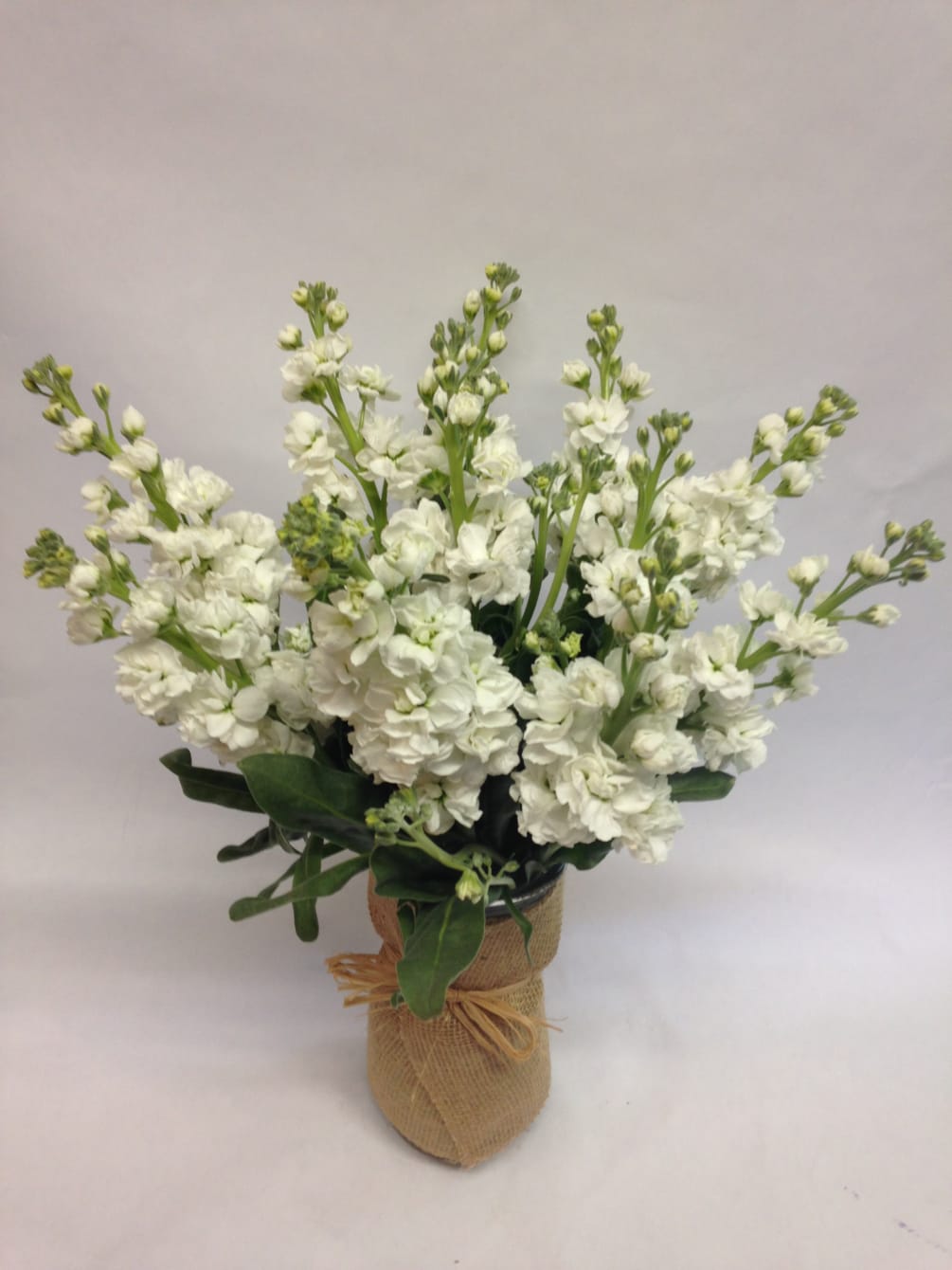This simple vase arrangement is filled with frangrant, white stock stems and