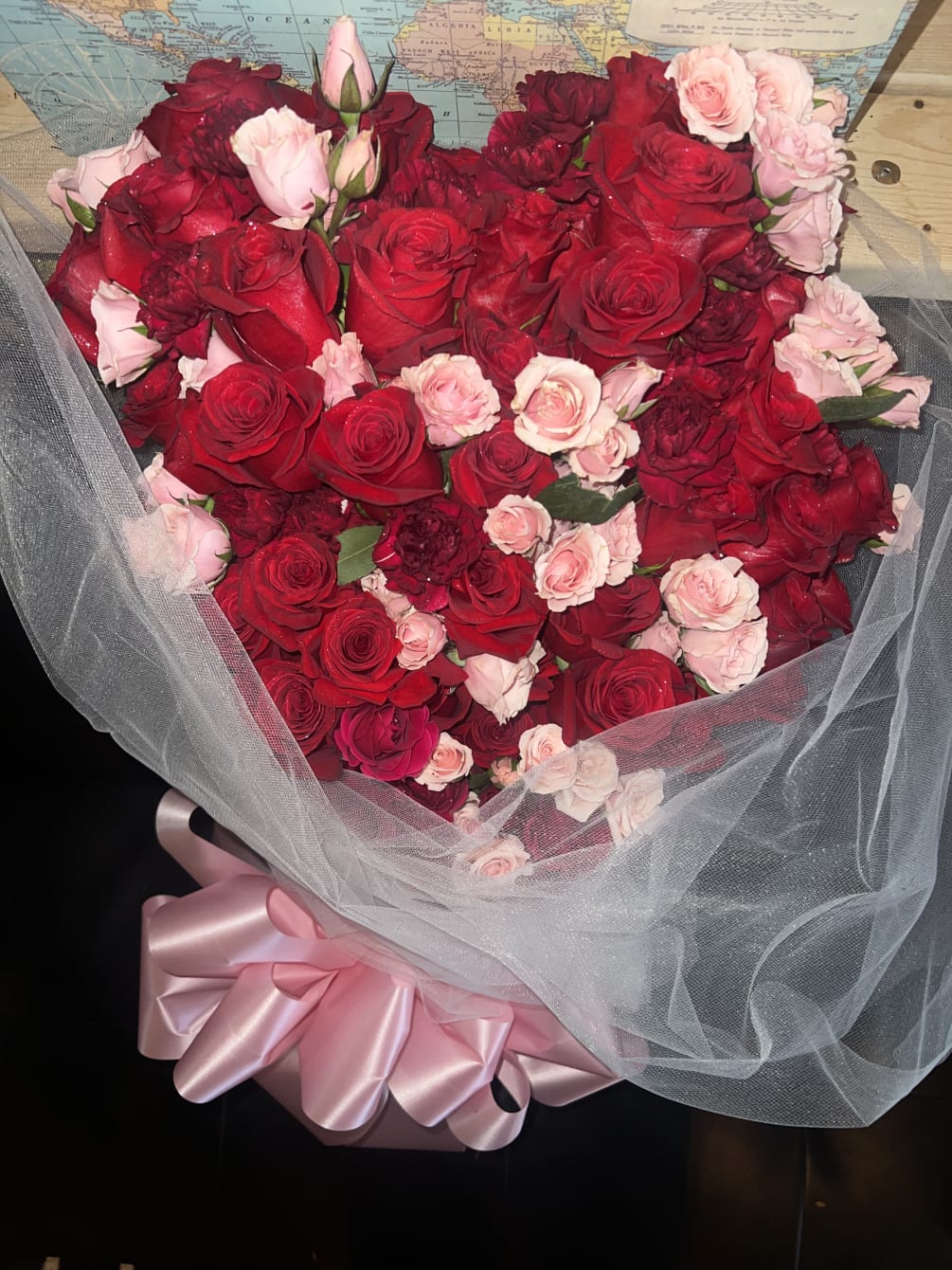 A rose bouquets with more than 50 roses that will draw the
