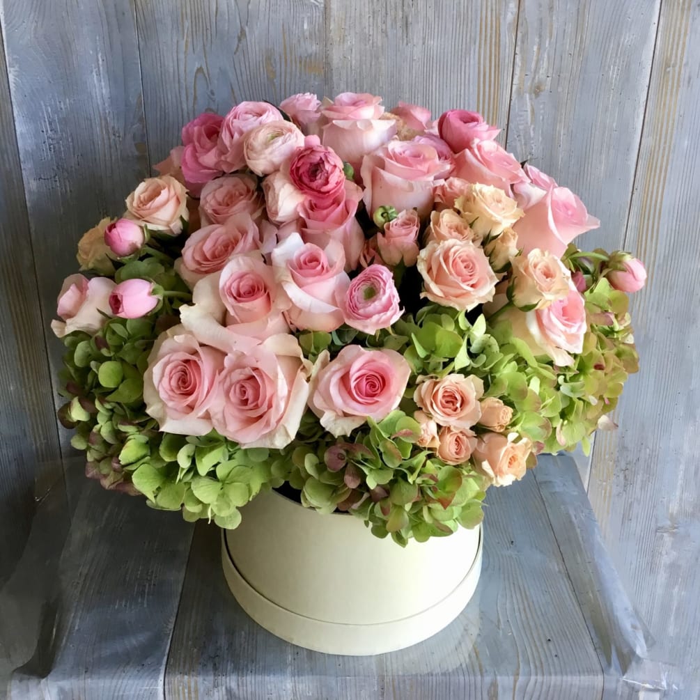 Two dozen roses with hydrangeas and other fillers to create a stunning